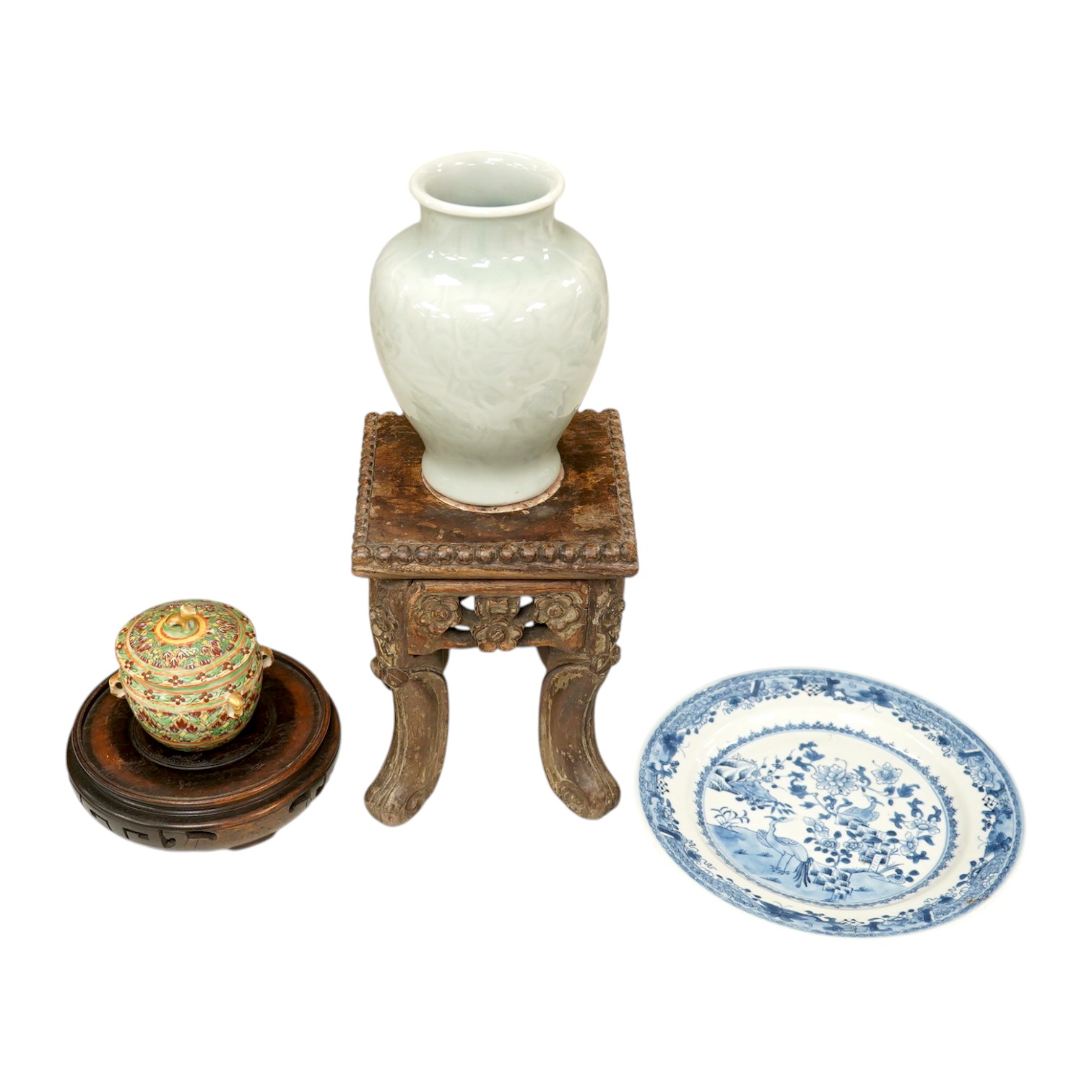 A Chinese celadon glazed vase, marble inset hardwood stand, 18th century Chinese Export blue and white plate, pot and cover and a circular wood stand, tallest 20cm. Condition - fair to good